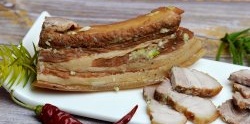 Pork belly boiled in onion skins - appetizing look, delicate taste