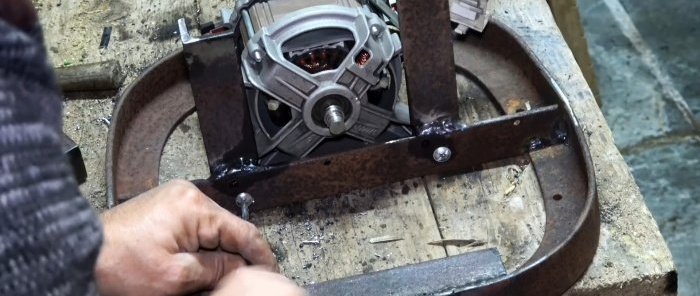 Two in one: how to make a belt grinder and polishing machine from a washing machine motor and an old shock absorber