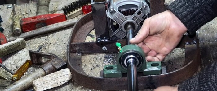 Two in one: how to make a belt grinder and polishing machine from a washing machine motor and an old shock absorber