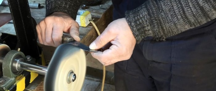 Two in one: how to make a belt grinder and polishing machine from a washing machine motor and an old shock absorber