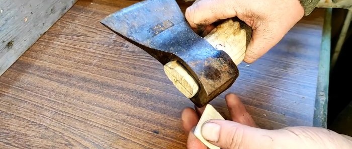 How to attach an ax to an ax handle using rubber