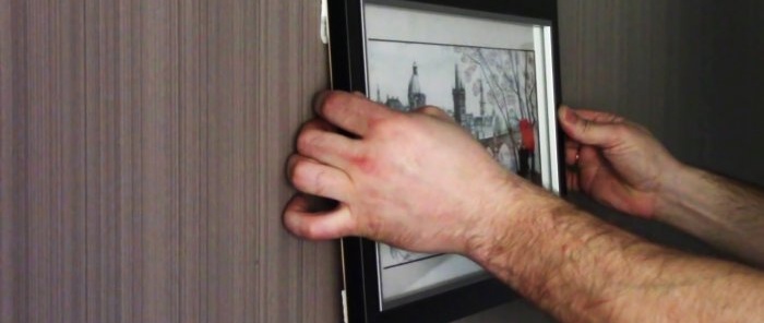 How to hang a picture without drilling nails or screws